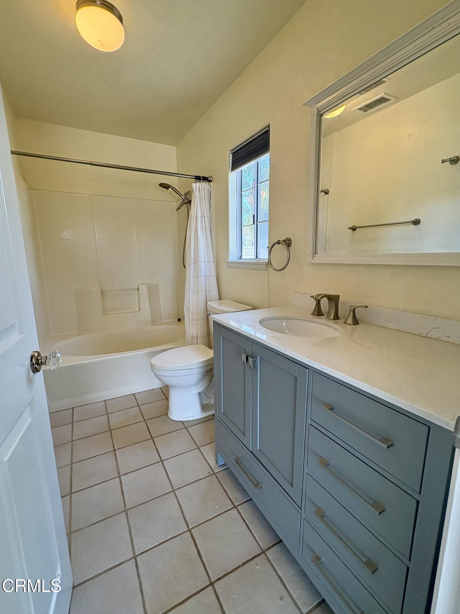133 Prospect Street Oak View, CA 93022 - Photo 14 of 19 a bathroom with a sink a toilet and shower