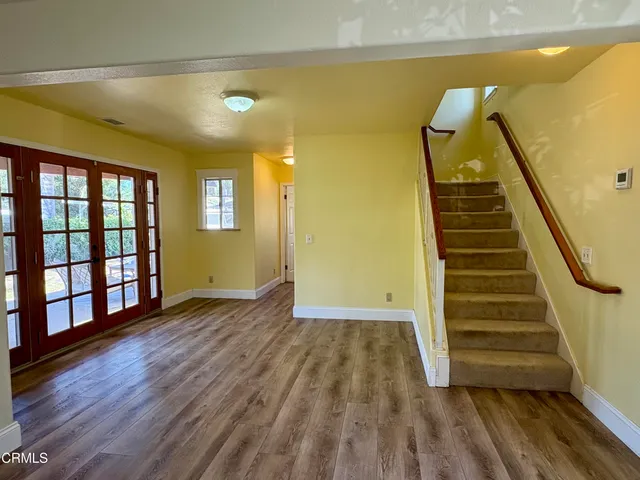 a view of an entryway with wooden floor
