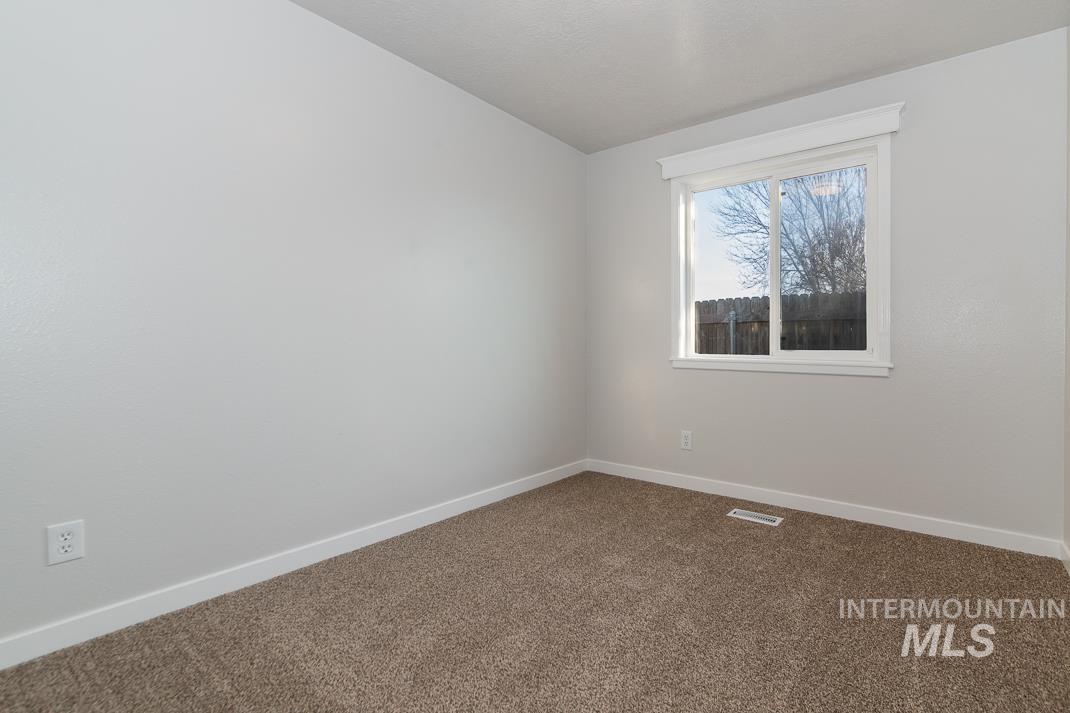 480 Easy Street Kuna, ID 83634 - Photo 11 of 39 Unfurnished room featuring baseboards and carpet floors