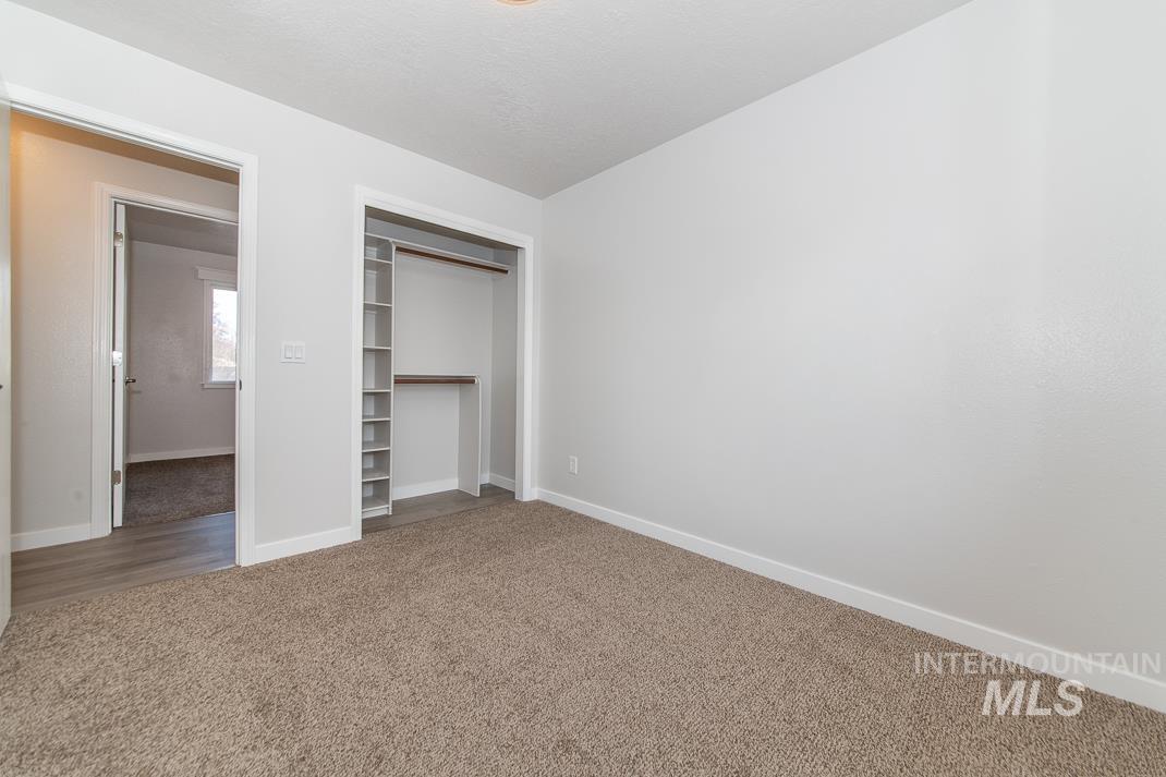 480 Easy Street Kuna, ID 83634 - Photo 12 of 39 Unfurnished bedroom featuring carpet and a closet