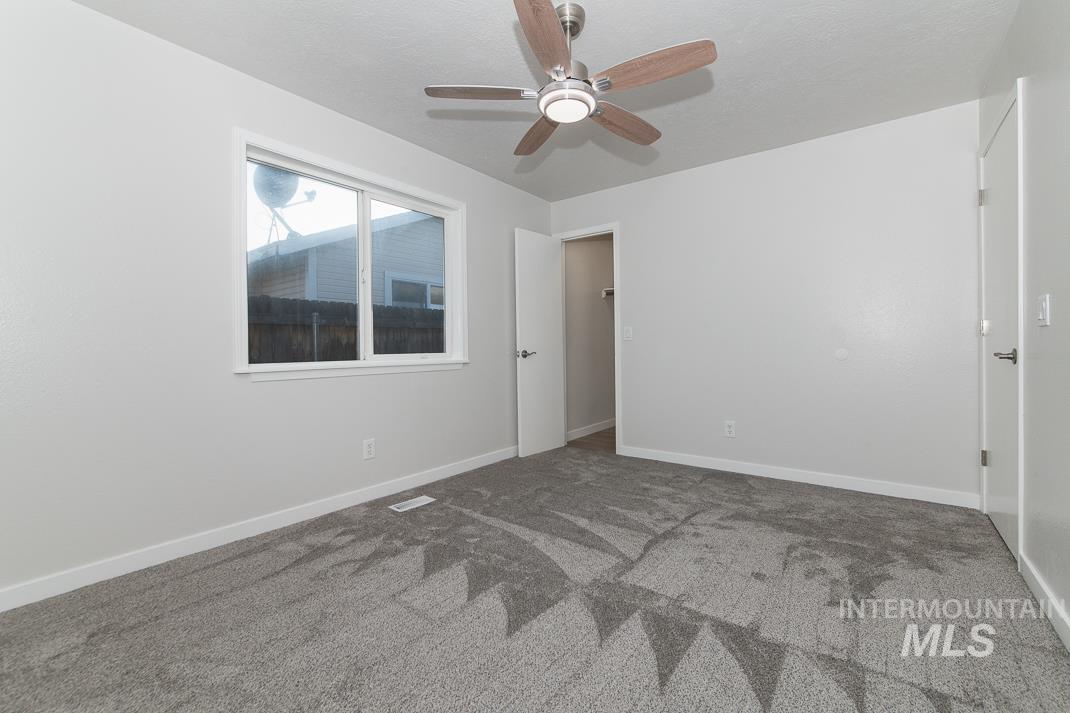 480 Easy Street Kuna, ID 83634 - Photo 16 of 39 Unfurnished bedroom featuring a ceiling fan and carpet
