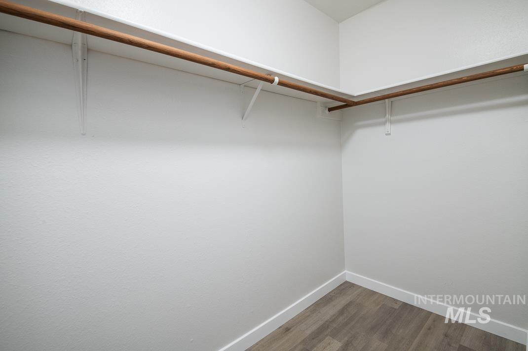 480 Easy Street Kuna, ID 83634 - Photo 18 of 39 Walk in closet with wood finished floors
