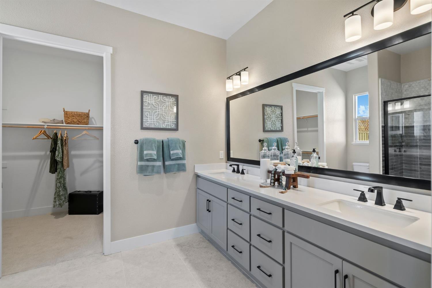 1838 Foster Lane Davis, CA 95616 - Photo 24 of 56 a spacious bathroom with a double vanity sink a mirror and a shower