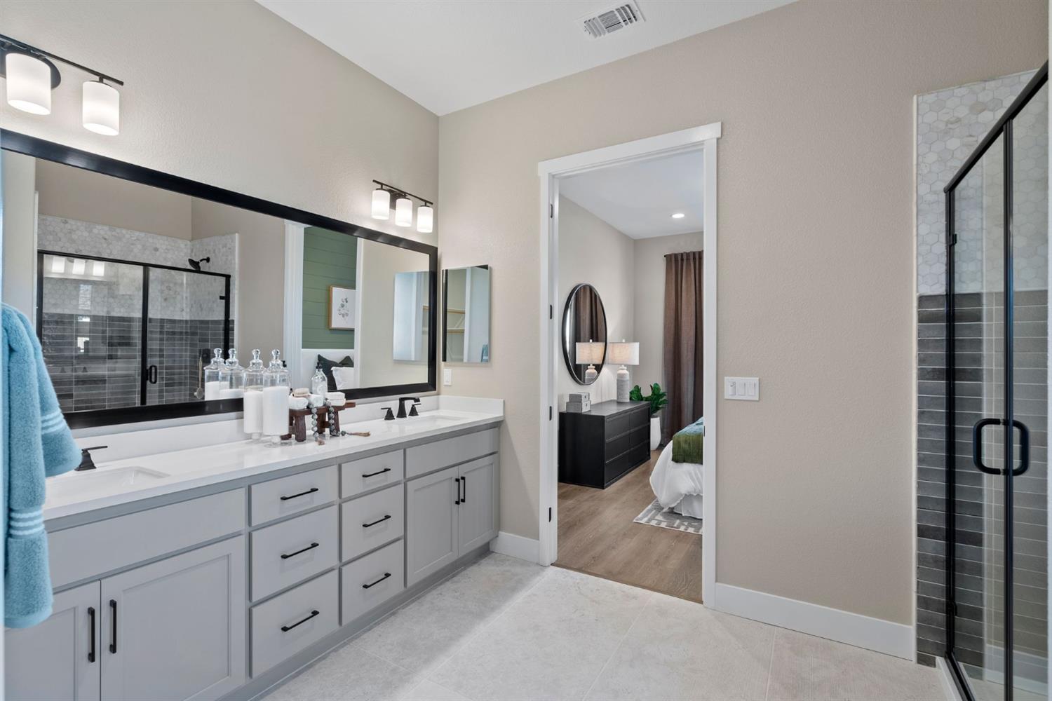 1838 Foster Lane Davis, CA 95616 - Photo 25 of 56 a bathroom with a double vanity sink and mirror