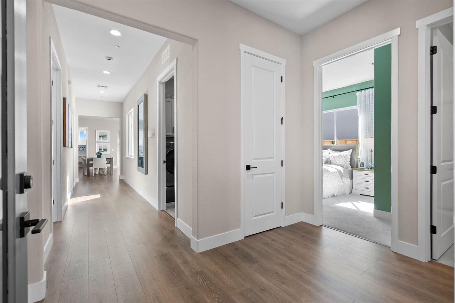 1838 Foster Lane Davis, CA 95616 - Photo 36 of 56 a view of a hallway with wooden floor a glass door and a living room