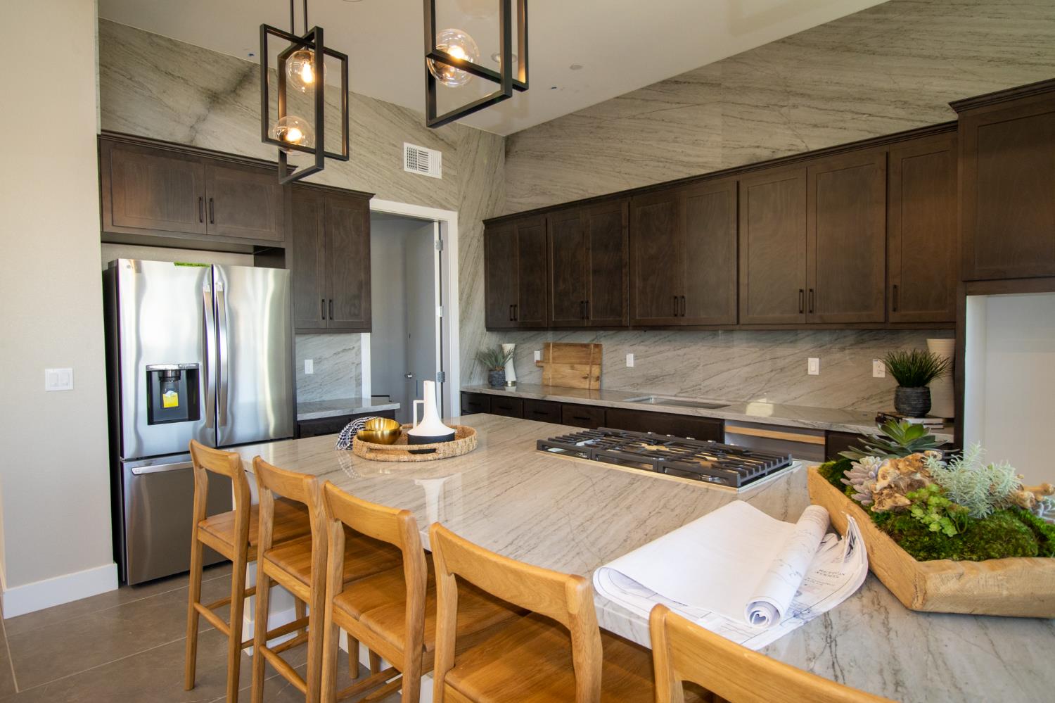 1838 Foster Lane Davis, CA 95616 - Photo 51 of 56 a kitchen with stainless steel appliances granite countertop a stove a refrigerator a sink a dining table and chairs with wooden floor