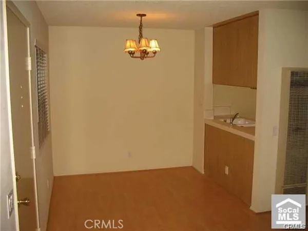 a view of an empty room with a door