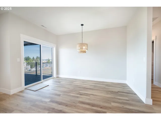 a view of kitchen and wooden floor