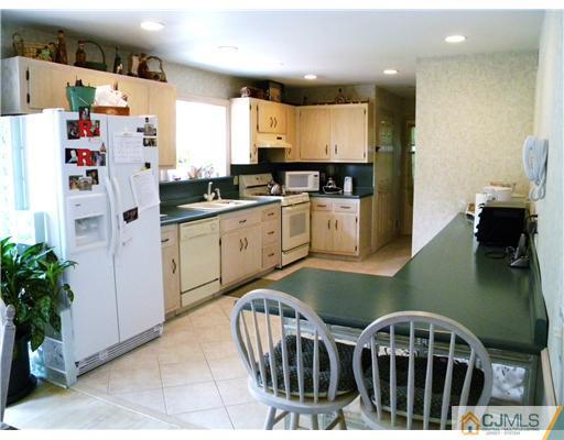 293 Friendship Road Cranbury, NJ 08512 - Photo 4 of 10 a kitchen with cabinets and furniture