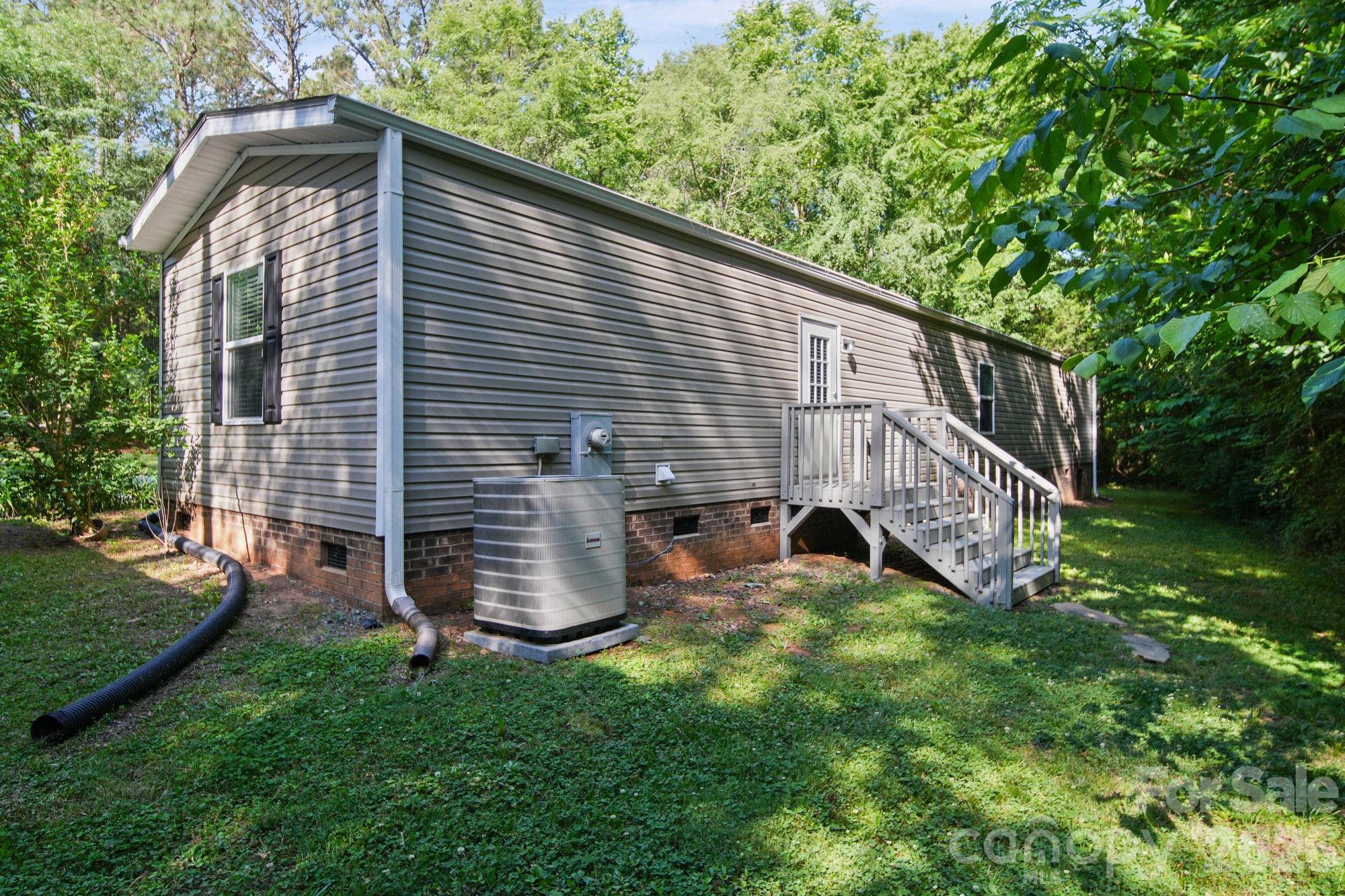 4507 White Store Road Wingate, NC 28174 - Photo 27 of 29 a backyard of a house with lots of green space