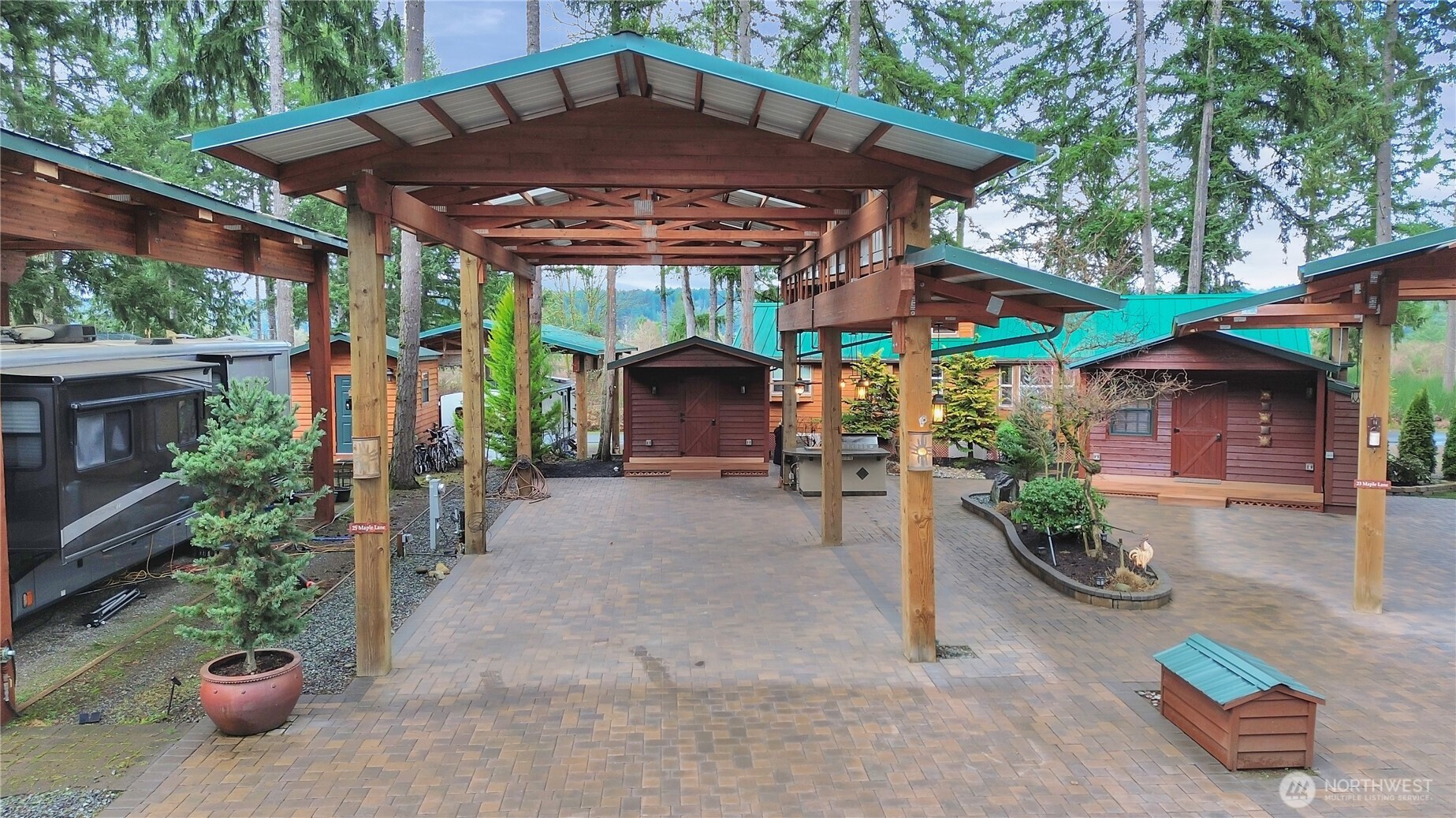 a view of a patio with furniture and a fire pit