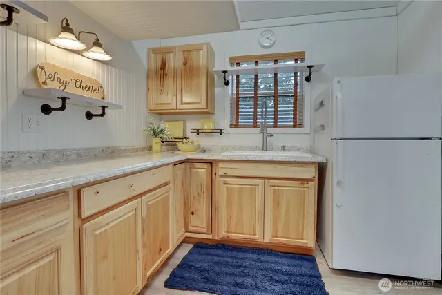 a kitchen with a sink and cabinets