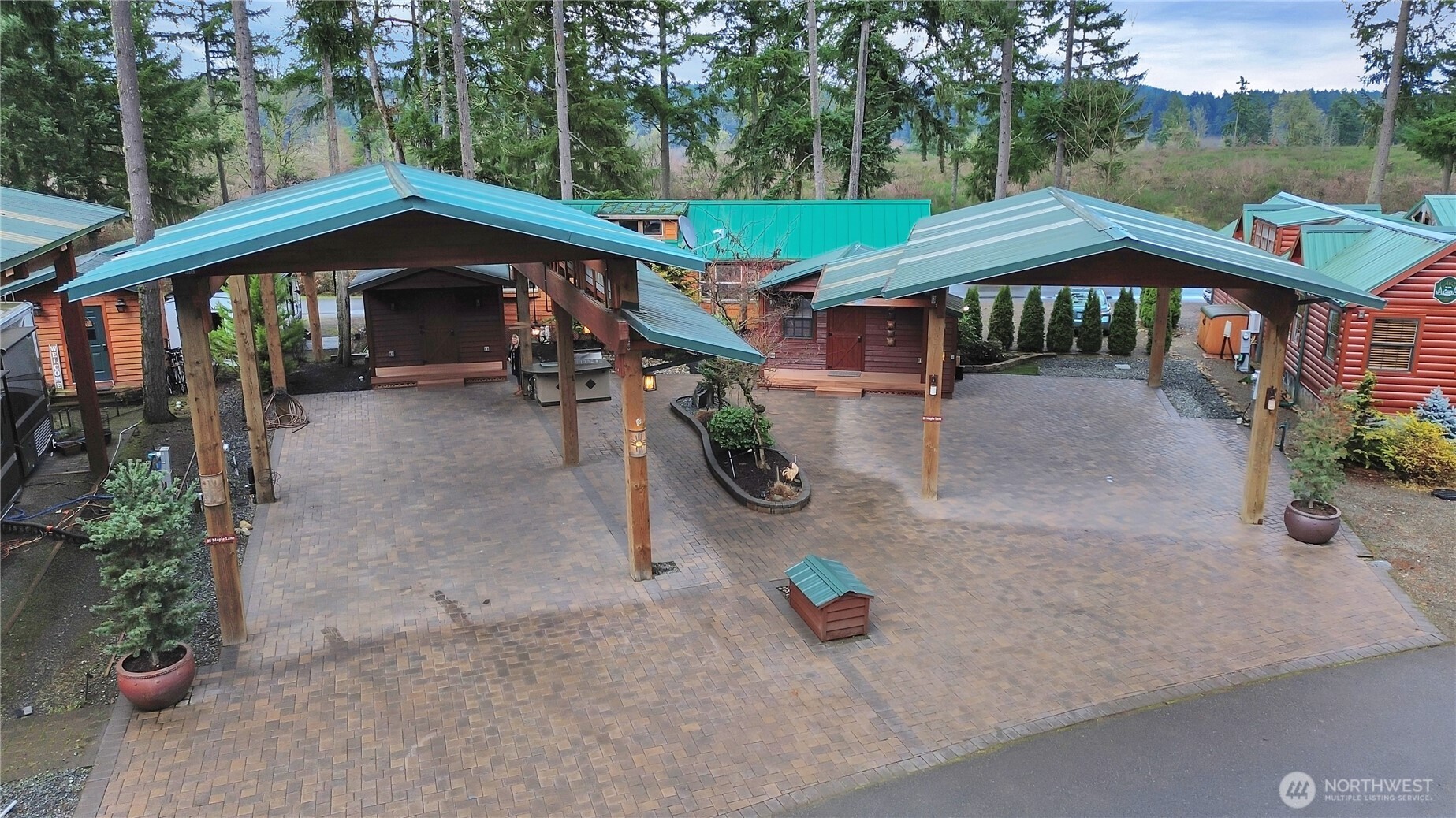 1546 Reservation Road Southeast, Unit 249 Olympia, WA 98513 - Photo 19 of 37 a backyard of a house with barbeque oven table and chairs