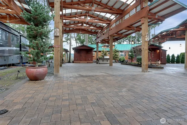 a view of a patio with table and chairs