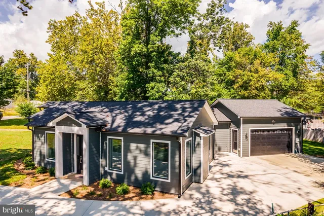 a yellow and red house with a outdoor space