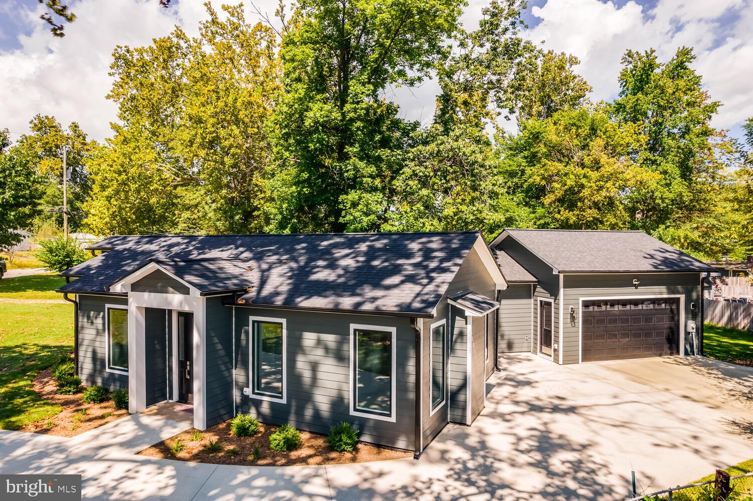 13711 Joyce Road Woodbridge, VA 22191 - Photo 1 of 54 a yellow and red house with a outdoor space