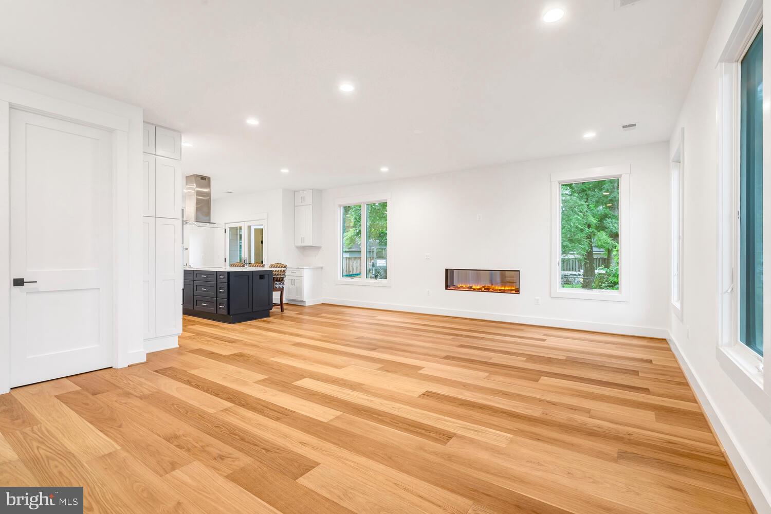 13711 Joyce Road Woodbridge, VA 22191 - Photo 14 of 54 a view of empty room with wooden floor and fan