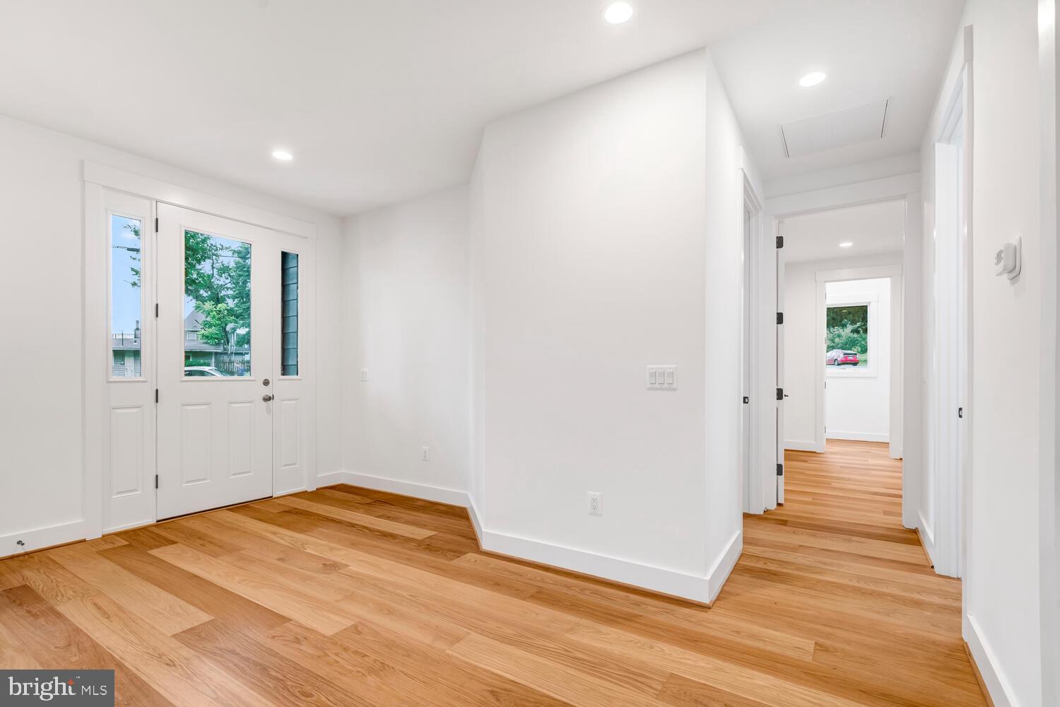13711 Joyce Road Woodbridge, VA 22191 - Photo 16 of 54 a view of a room with wooden floor and windows