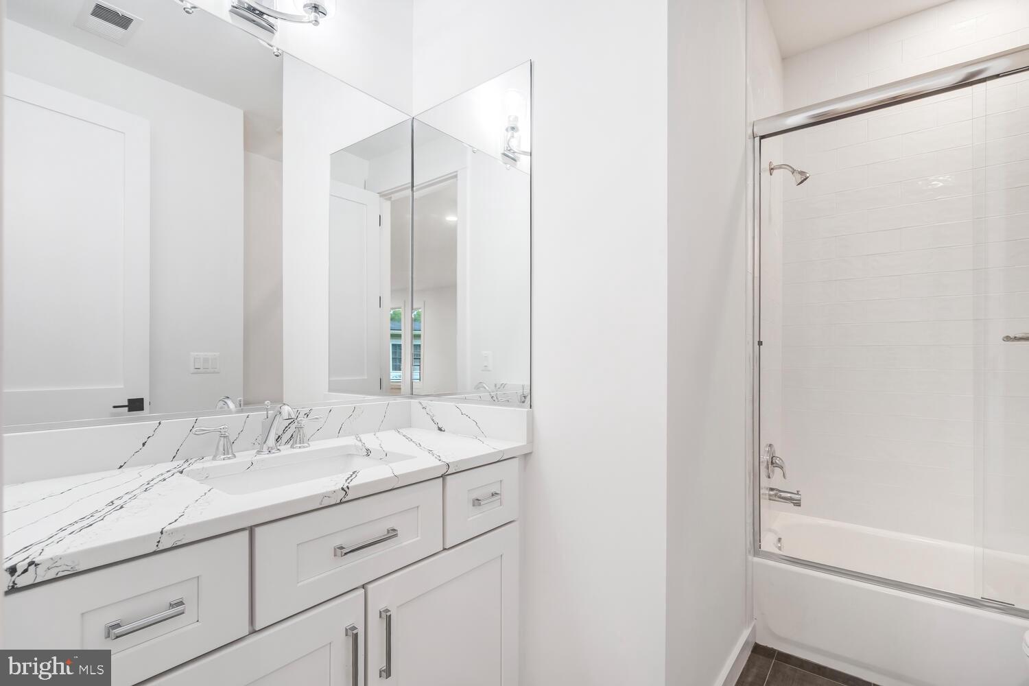 13711 Joyce Road Woodbridge, VA 22191 - Photo 28 of 54 a bathroom with a double vanity sink mirror and double