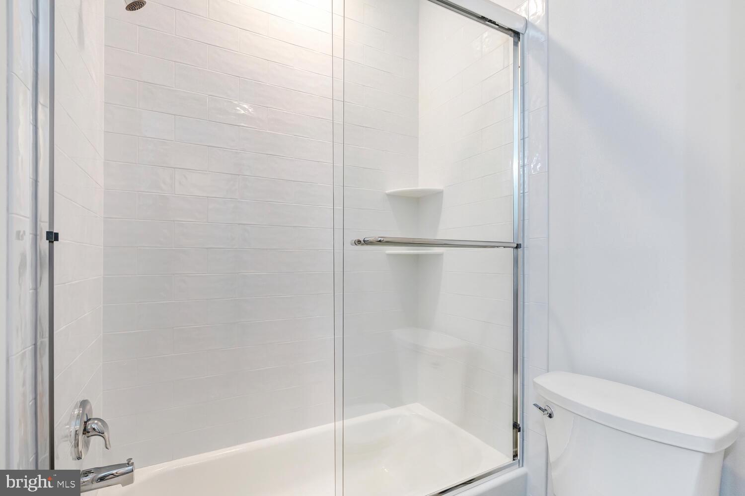 13711 Joyce Road Woodbridge, VA 22191 - Photo 29 of 54 a bathroom with a shower and a toilet