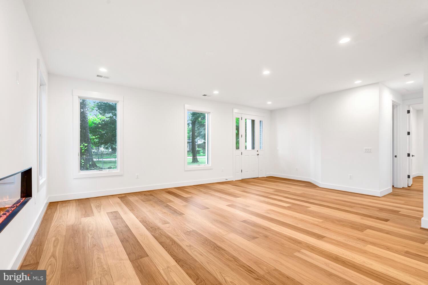 13711 Joyce Road Woodbridge, VA 22191 - Photo 31 of 54 a view of empty room with wooden floor and fan