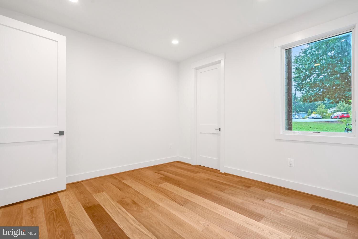 13711 Joyce Road Woodbridge, VA 22191 - Photo 32 of 54 a view of empty room with wooden floor and fan