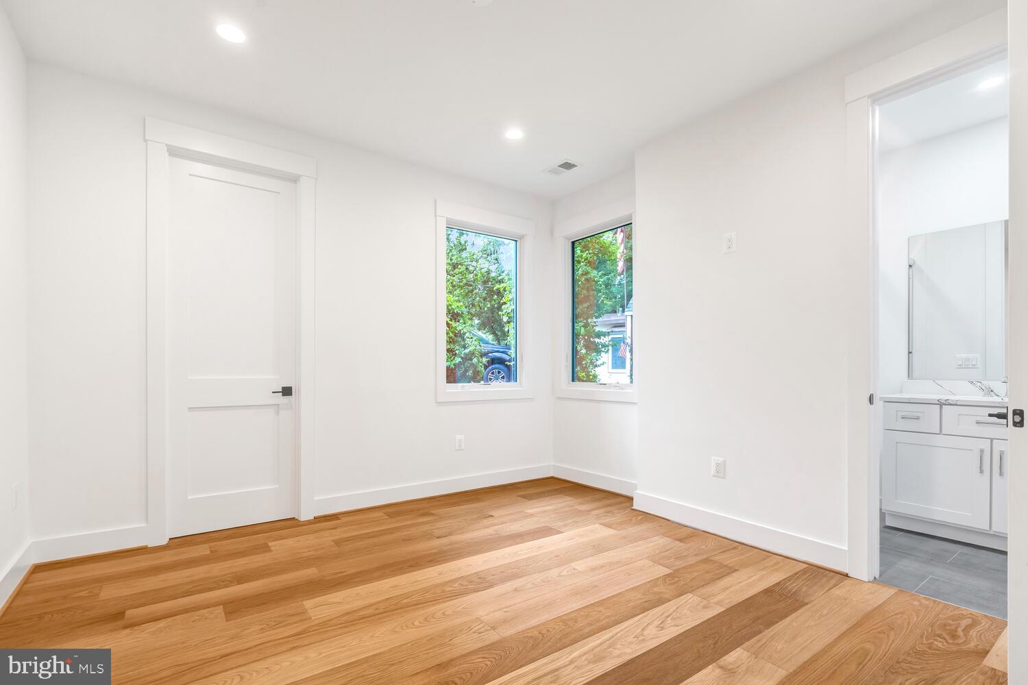 13711 Joyce Road Woodbridge, VA 22191 - Photo 33 of 54 a view of an empty room with wooden floor and a window