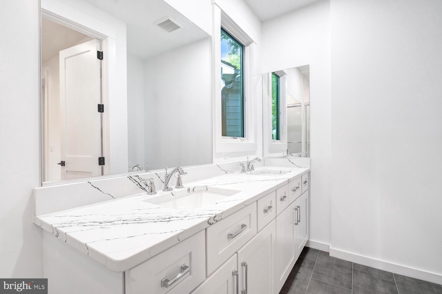 13711 Joyce Road Woodbridge, VA 22191 - Photo 34 of 54 a bathroom with a granite countertop sink and a mirror