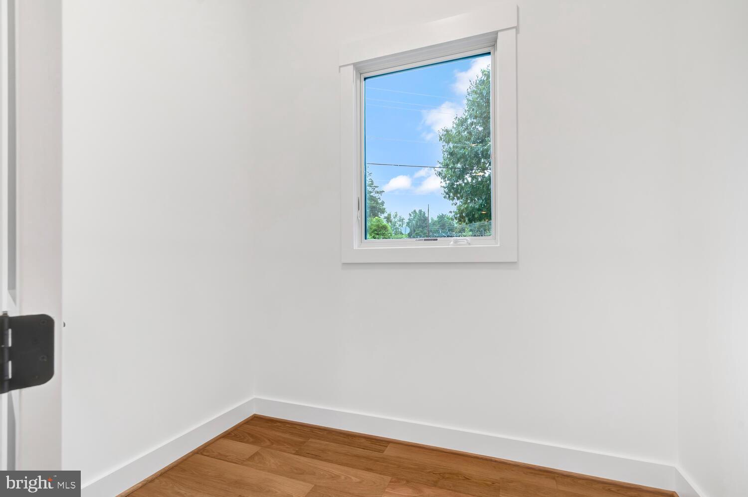 13711 Joyce Road Woodbridge, VA 22191 - Photo 36 of 54 a view of a small space with wooden floor and a window