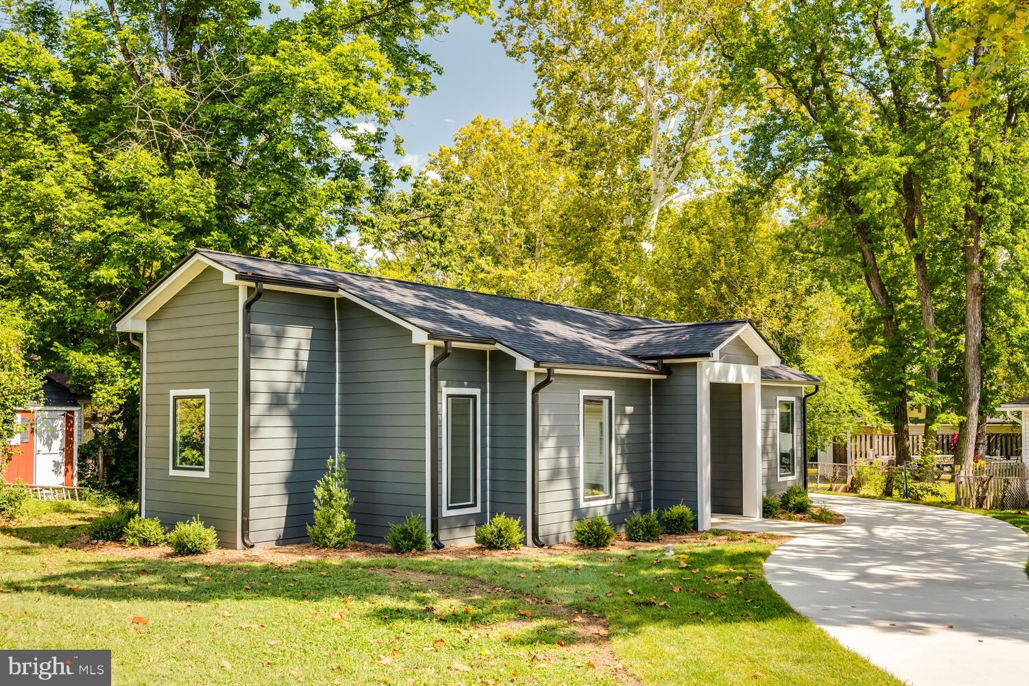 13711 Joyce Road Woodbridge, VA 22191 - Photo 39 of 54 a front view of house with yard and green space