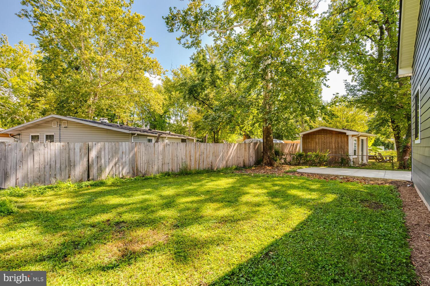 13711 Joyce Road Woodbridge, VA 22191 - Photo 44 of 54 a view of a backyard with a small cabin