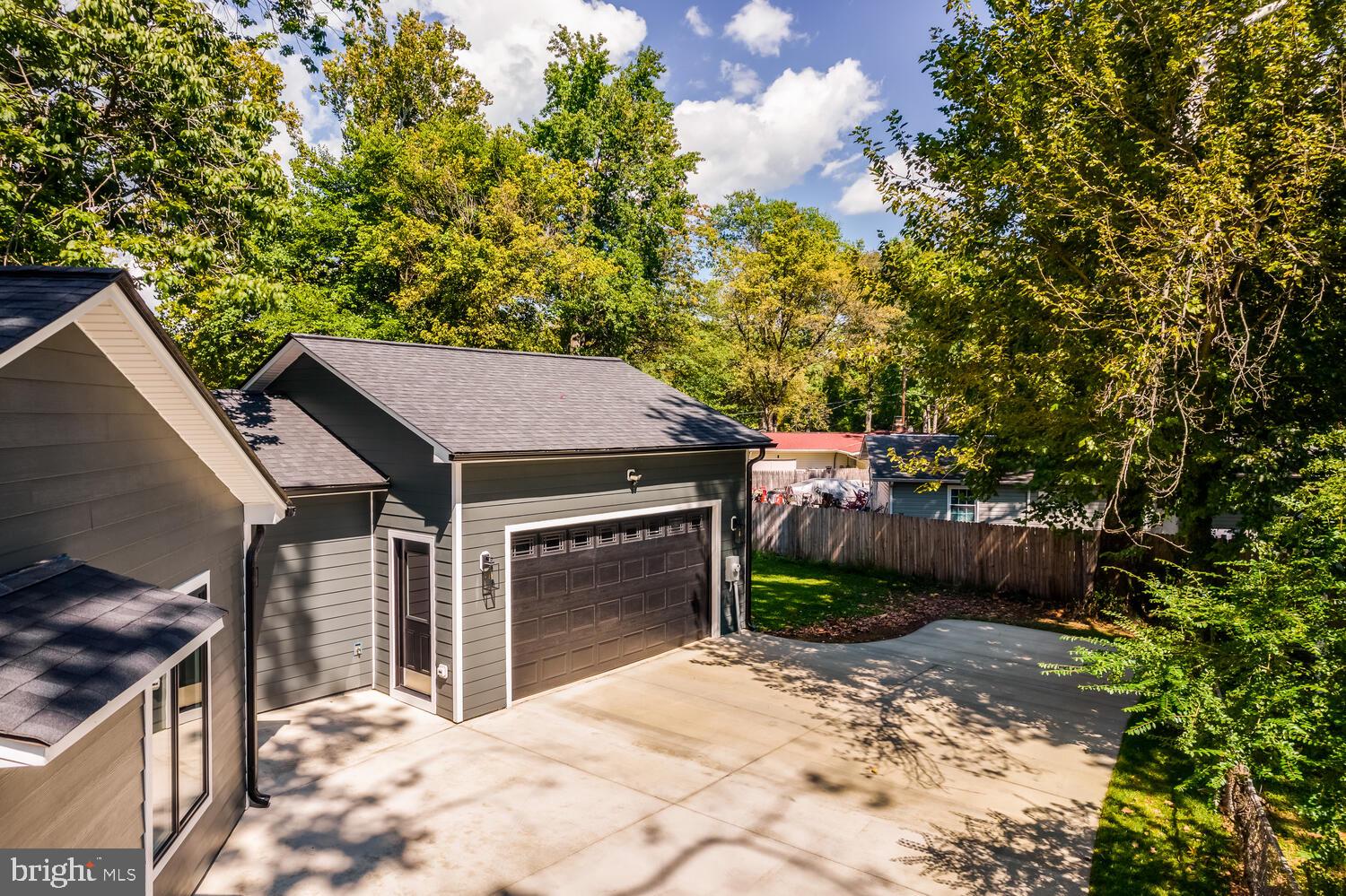 13711 Joyce Road Woodbridge, VA 22191 - Photo 49 of 54 a view of a house with a yard