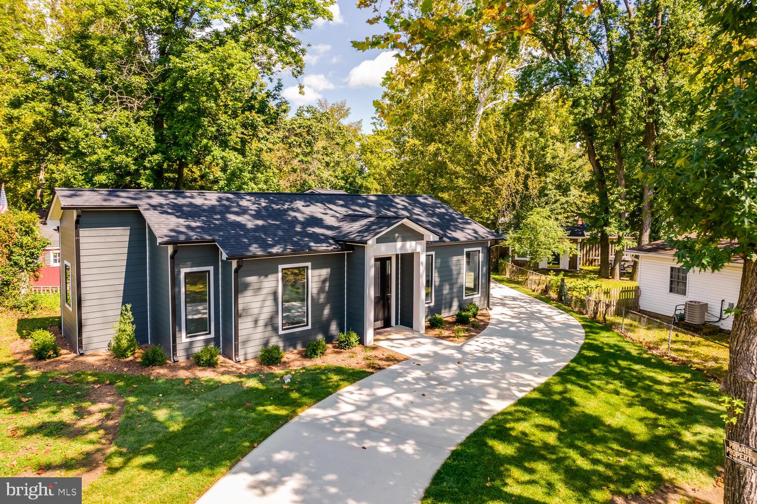 13711 Joyce Road Woodbridge, VA 22191 - Photo 53 of 54 a view of a house with garden and pathway