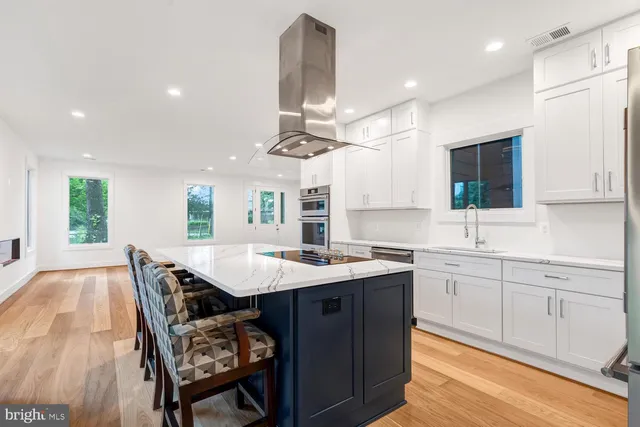 a kitchen with a stove sink and refrigerator