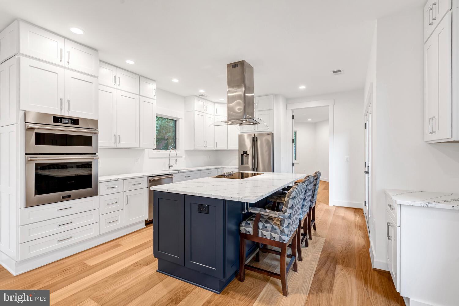 13711 Joyce Road Woodbridge, VA 22191 - Photo 10 of 54 a kitchen with stainless steel appliances kitchen island granite countertop a stove a sink and a refrigerator