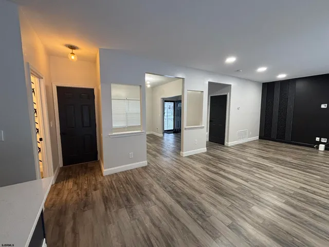 a view of a livingroom with wooden floor