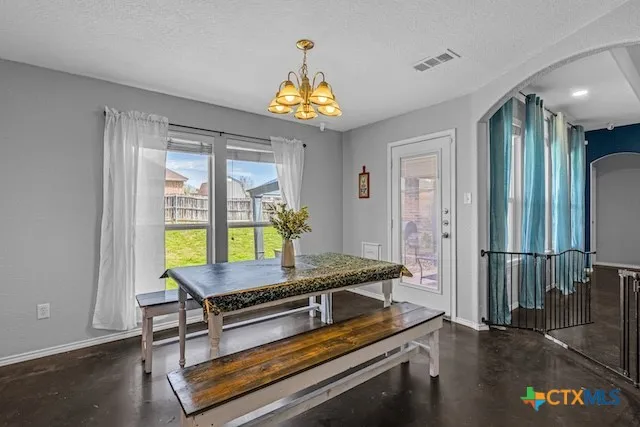 a room with pool table and windows