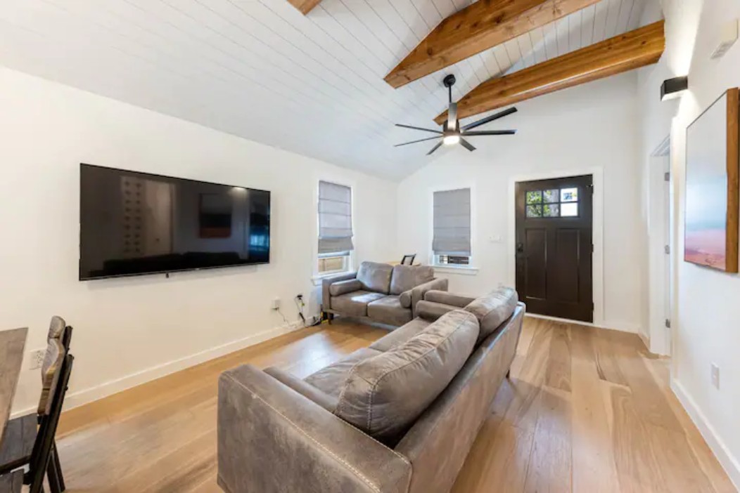 2319 Santa Rita Street Austin, TX 78702 - Photo 14 of 26 Living room featuring light wood-style floors, a high wooden beamed ceiling, and ceiling fan
