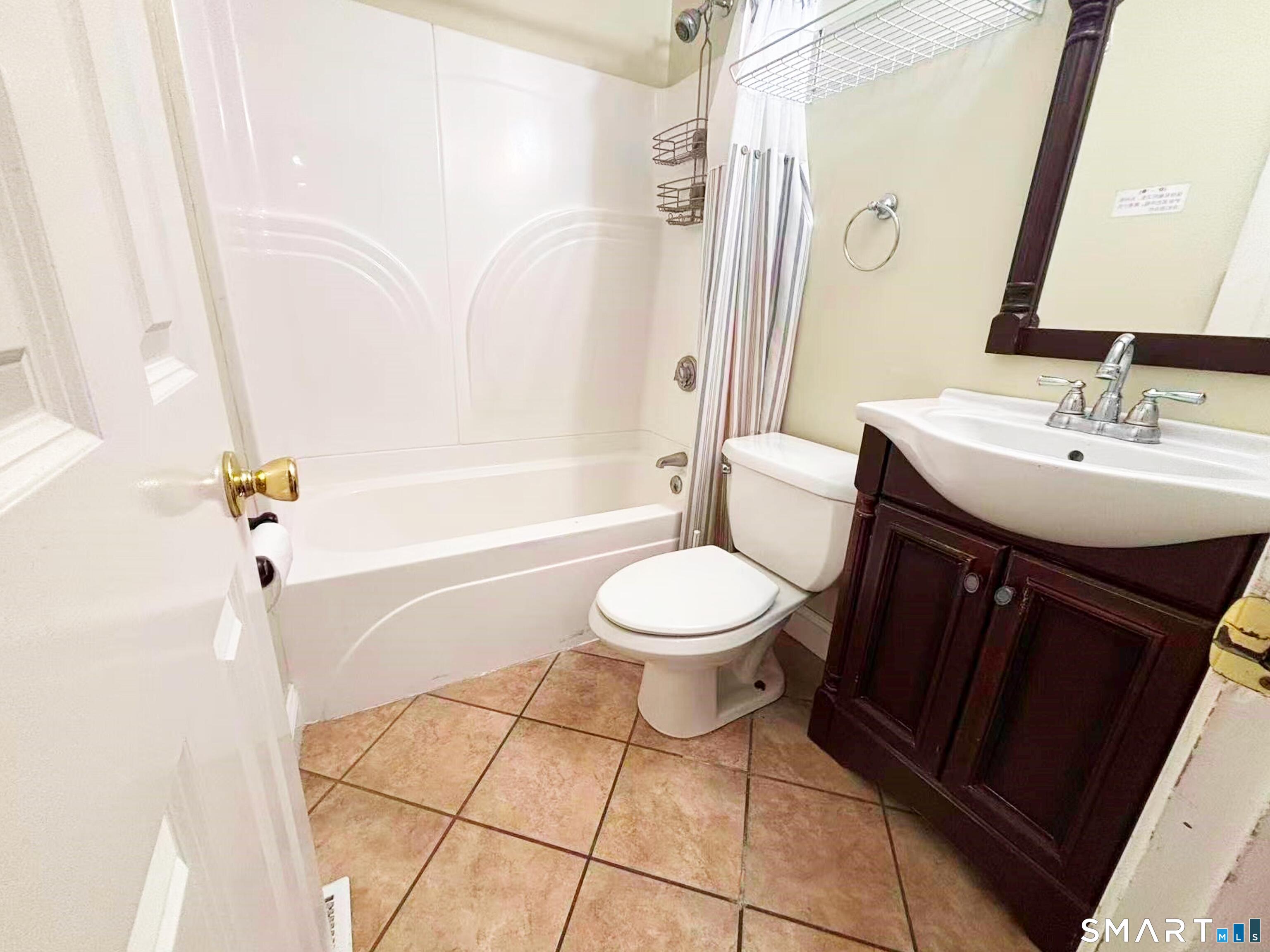 52 Monce Road Burlington, CT 06013 - Photo 15 of 26 a bathroom with a sink toilet and shower