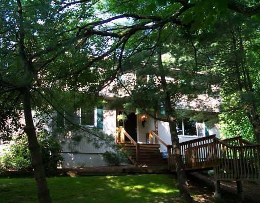 185 West Norwalk Road Norwalk, CT 06850 - Photo 1 of 1 a view of a house with a tree in a yard