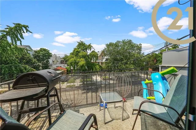 a view of a chairs and table in patio