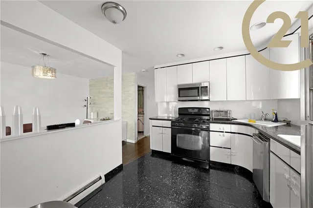 a kitchen with a sink stainless steel appliances and cabinets