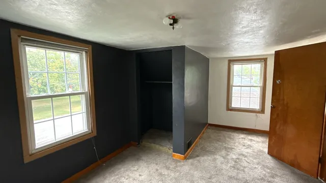 an empty room with windows