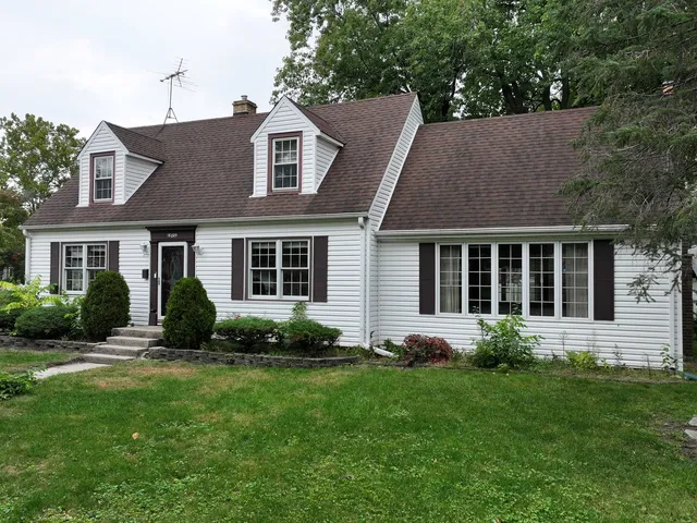 a view of a house with next to a yard