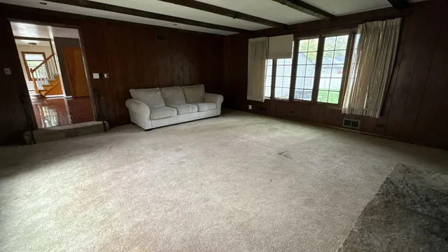 a view of an empty room with a fireplace