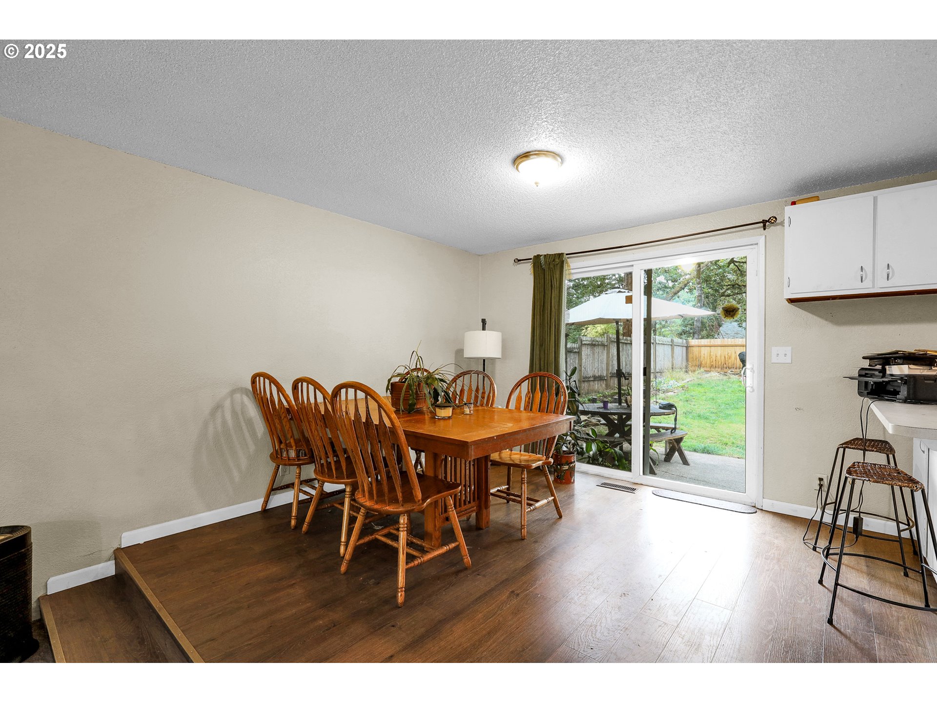 910 East 43rd Avenue Eugene, OR 97405 - Photo 11 of 47 a view of a dining room with furniture window and wooden floor