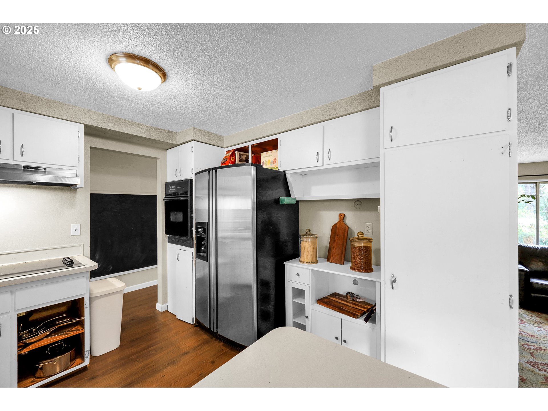 910 East 43rd Avenue Eugene, OR 97405 - Photo 14 of 47 a kitchen with stainless steel appliances kitchen island a refrigerator sink and stove