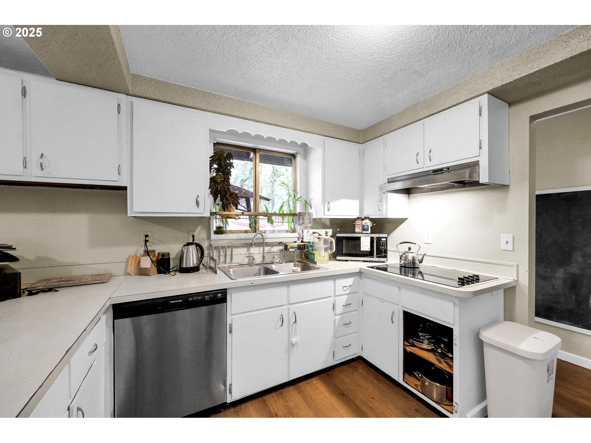 910 East 43rd Avenue Eugene, OR 97405 - Photo 15 of 47 a kitchen with a sink a stove a refrigerator and cabinets