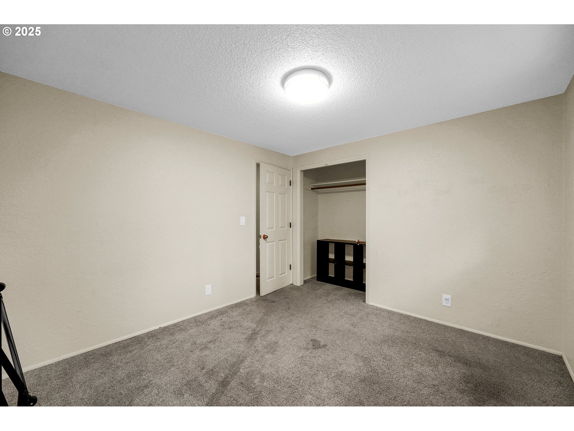 910 East 43rd Avenue Eugene, OR 97405 - Photo 24 of 47 a view of an empty room with a fireplace