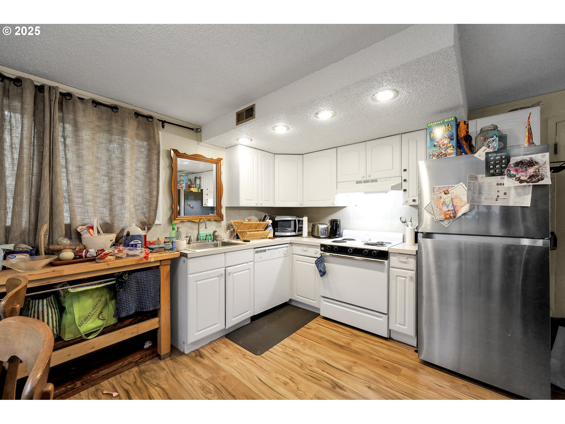 910 East 43rd Avenue Eugene, OR 97405 - Photo 37 of 47 a kitchen with sink cabinets and wooden floor